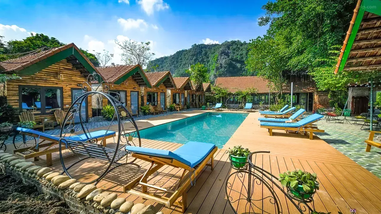 Outdoor swimming pool surrounded by stunning limestone karst mountains